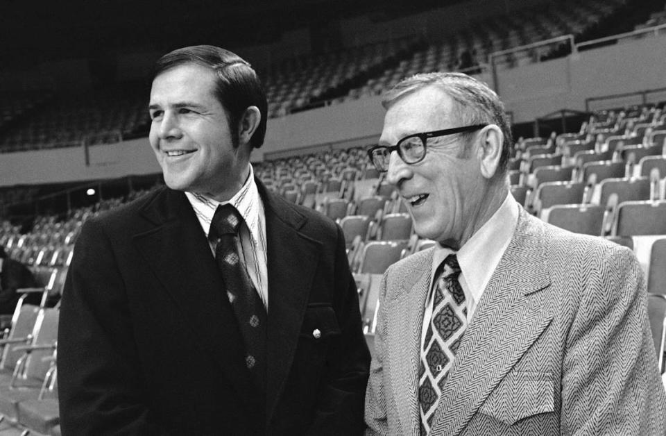Denny Crum, left, was an assistant to legendary UCLA head coach John Wooden, right, during three national championship seasons for the Bruins before Crum took over as head coach at Louisville.