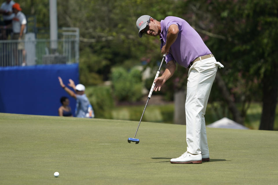 Adam Scott, of Australia, putts on the 18th hole during the final round of the Wyndham Championship golf tournament in Greensboro, N.C., Sunday, Aug. 6, 2023. (AP Photo/Chuck Burton)