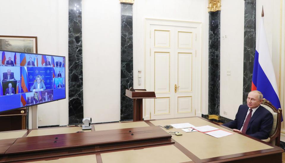 Russian President Vladimir Putin chairs a Security Council meeting via video conference in Moscow, Russia, Friday, Feb. 5, 2021. (Mikhail Klimentyev, Sputnik, Kremlin Pool Photo via AP)