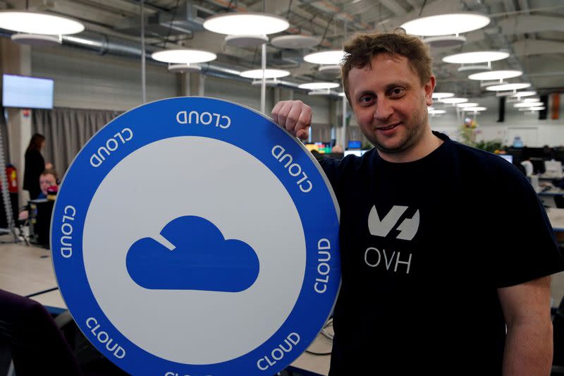 FILE PHOTO: Octave Klaba, founder and CEO of OVH, poses near a company logo at the hotline service desk of French web-hosting and server provider OVH data centre site in Roubaix