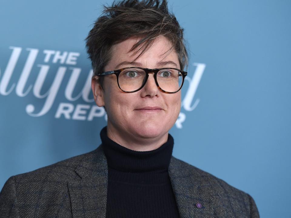 Hannah Gadsby wearing a black turtleneck and gray blazer in December 2018.