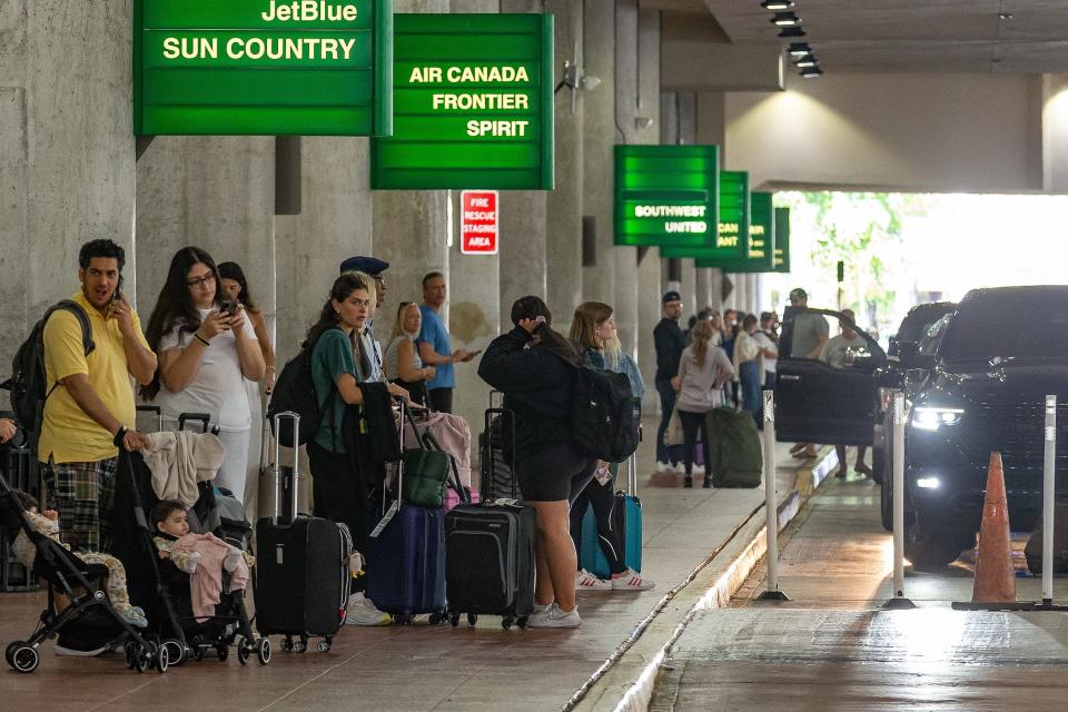 Arriving passengers wait for their automobile pickups outside of the baggage claim exits on the ground floor as Labor Day weekend travelers to and from south Florida move through Palm Beach International Airport in unincorporated Palm Beach County on, Fla., on September 1, 2023.