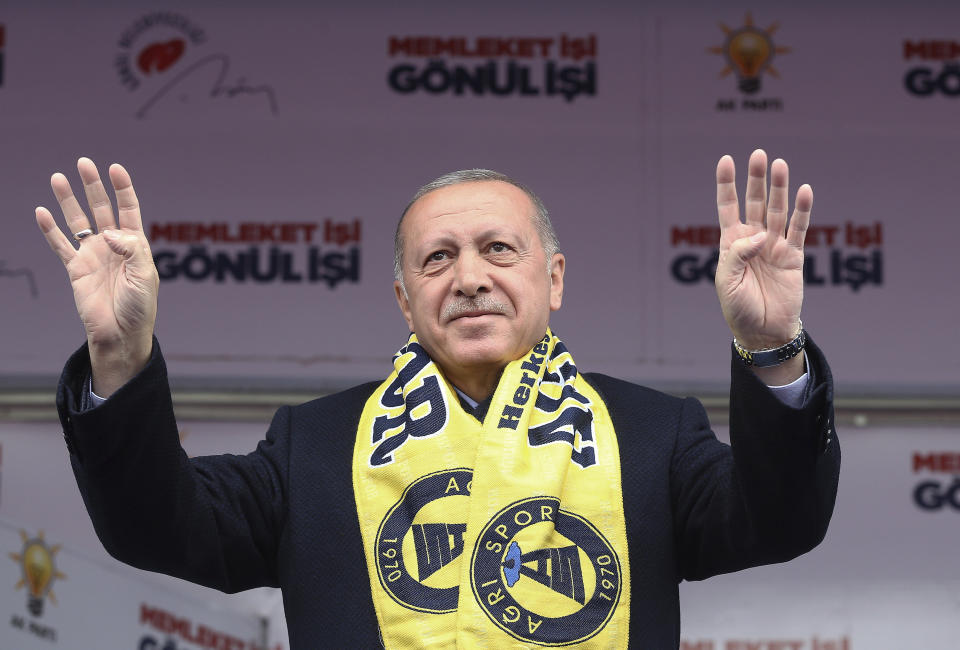 Turkey's President Recep Tayyip Erdogan salutes the supporters of his ruling Justice and Development Party during a rally in Agri, Turkey, Monday, March 25, 2019. Istanbul's Hagia Sophia, a Byzantine-era cathedral that was turned into a mosque and now serves as a museum, could be reconverted into a mosque, Erdogan has said during a television interview late on Sunday ahead of Turkey's March 31 local elections.(Presidential Press Service via AP, Pool)