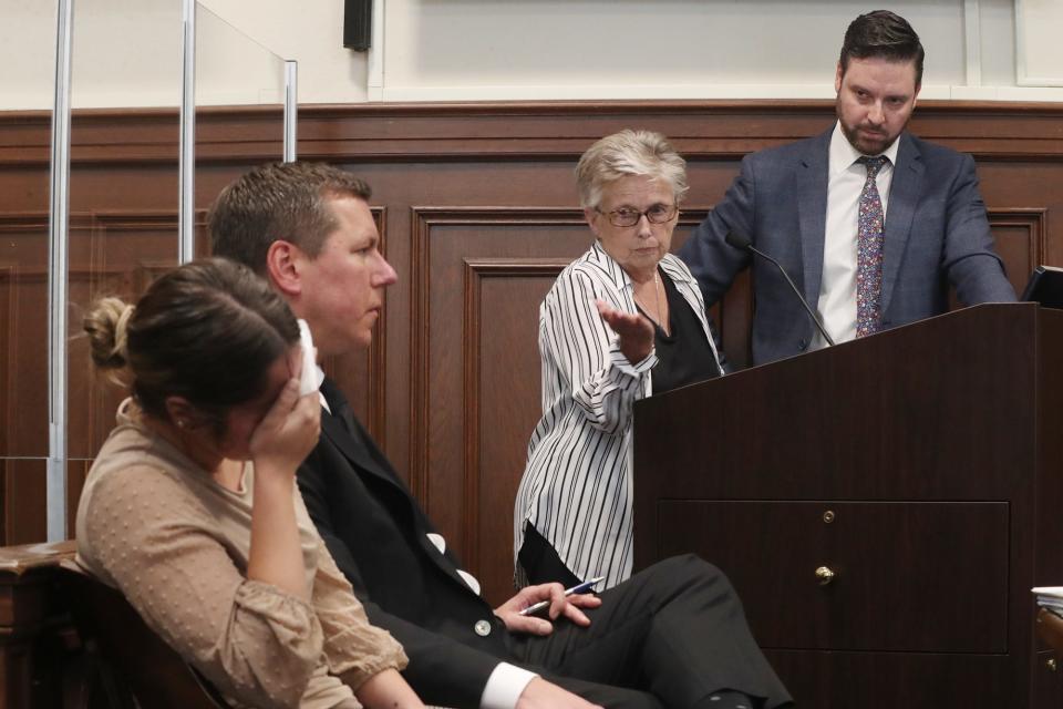 Betsy Brown, middle, the maternal grandmother of Sydney Powell, speaks during a recent pretrial in Summit County Common Pleas Court. Sydney, who is charged with murder in the stabbing death of her mother, can be seen in the foreground next to Don Malarcik, her attorney. Jeff Laybourne, far right, is representing the Powell family.