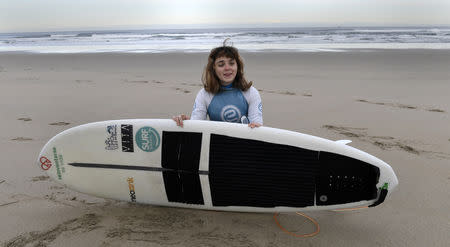 Carmen Lopez Garcia, Spain's first blind female surfer who is to participate in the ISA World Adaptive Surfing Championship, poses before training at Salinas beach, Spain, December 5, 2018. REUTERS/Eloy Alonso