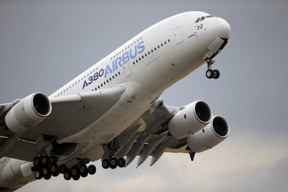 FILE - In this June 18, 2015, file photo, an Airbus A380 takes off for its demonstration flight at the Paris Air Show in Le Bourget airport, north of Paris. European plane maker Airbus lost 1.1 billion euros ($1.3 billion) amid an unprecedented global slump in air travel because of the pandemic, but expects to deliver hundreds of planes and make a profit this year. (AP Photo/Francois Mori, File)