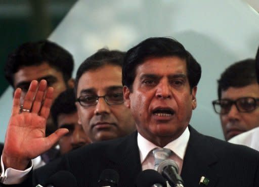 Pakistan's Prime Minister Raja Pervez Ashraf (C) is shown in Karachi in June 2012. Pakistan's top court has summoned the new prime minister to appear later this month to face possible contempt charges, escalating a wrangle over corruption cases against the president