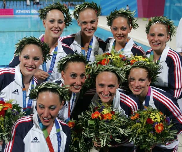 The bronze-medal-winning U.S. synchronized swimmers pose at the Athens 2004 Olympic Games. Reuters