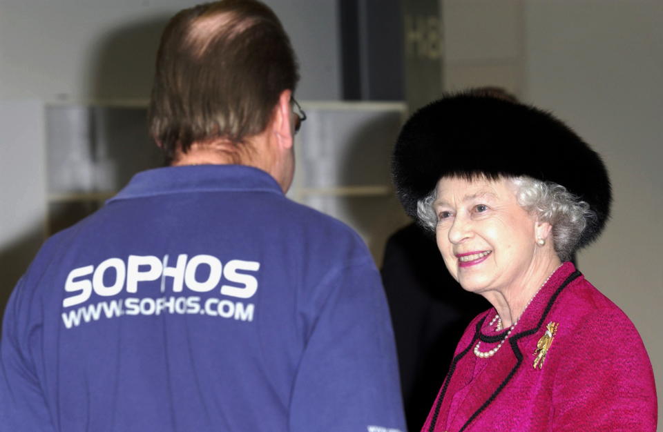 ABINGDON, UNITED KINGDOM - FEBRUARY 20:  Queen Elizabeth II Visiting Computer Software Company Sophos, Which Produces Anti-virus Software, Chats With One Of The Employees About His Work.  (Photo by Tim Graham Photo Library via Getty Images)