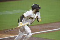 San Diego Padres' Fernando Tatis Jr. (23) hits a double during the third inning of a baseball game against the Seattle Mariners, Saturday, Sept. 19, 2020, in San Diego. (AP Photo/Denis Poroy)