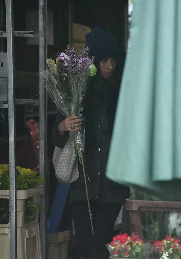 The 'Suits' actress picked out some green and purple blooms for her love nest with Prince Harry. Photo: LDNPIX / MEGA