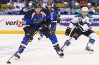 ST. LOUIS, MO - APRIL 14: David Backes #42 of the St. Louis Blues moves the puck up ice against Tommy Wingels #57 of the San Jose Sharks during Game Two of the Western Conference Quarterfinals during the 2012 NHL Stanley Cup Playoffs at the Scottrade Center on April 14, 2012 in St. Louis, Missouri. (Photo by Dilip Vishwanat/Getty Images)