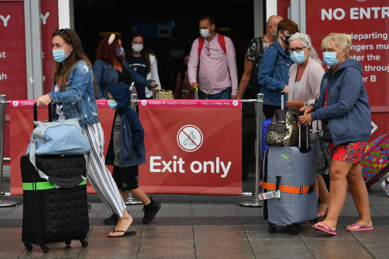 Passengers arriving at Birmingham Airport, as people arriving into England from holidays in Spain have been told they must quarantine when they return home. (Photo by Jacob King/PA Images via Getty Images)