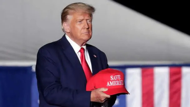 PHOTO: Former President Donald Trump tosses caps to the crowd as he holds a rally on Sept. 23, 2022, in Wilmington, N.C. (Chris Seward/AP, FILE)