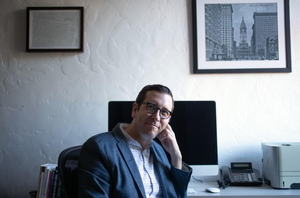 A man sits in an office