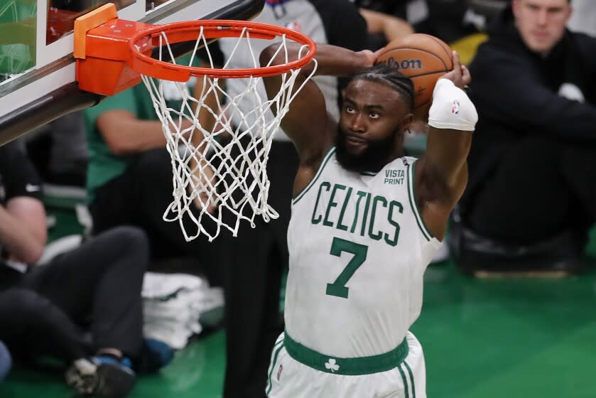 Boston Celtics guard Jaylen Brown (7) dunks the ball against the Golden State Warriors.