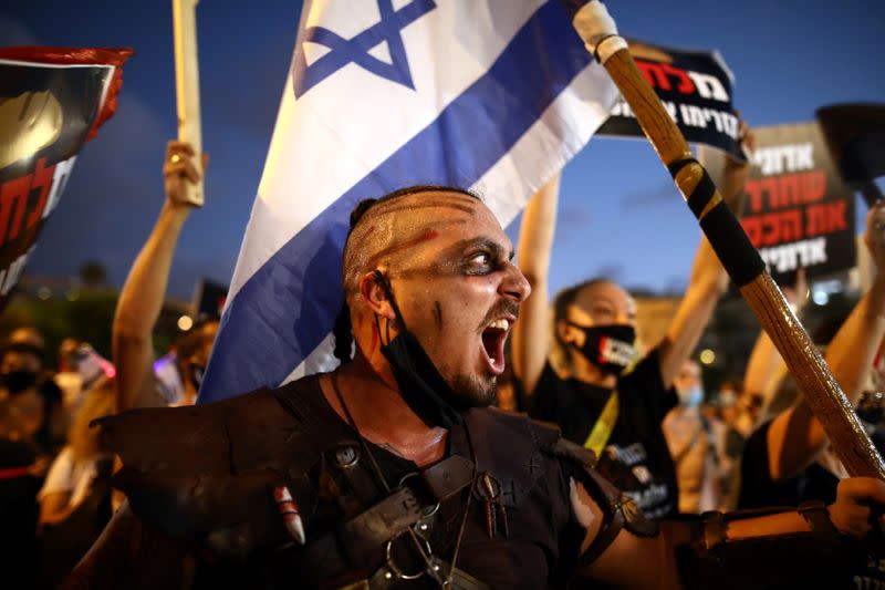 Israelis protest against the government's response to the financial fallout of the coronavirus disease (COVID- 19) crisis at Rabin square in Tel Aviv