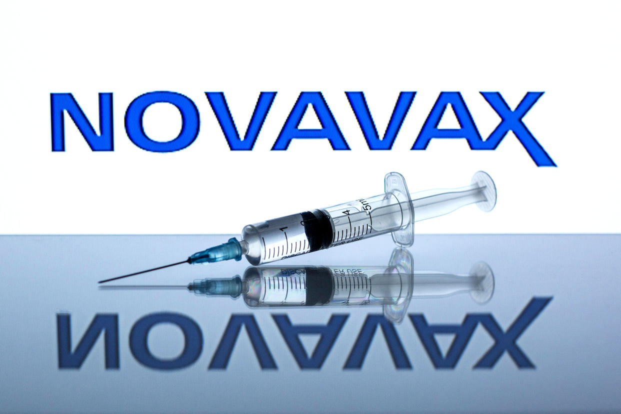 SPAIN - 2021/03/02: In this photo illustration a medical syringe seen displayed in front of the Novavax logo. (Photo Illustration by Thiago Prudêncio/SOPA Images/LightRocket via Getty Images)