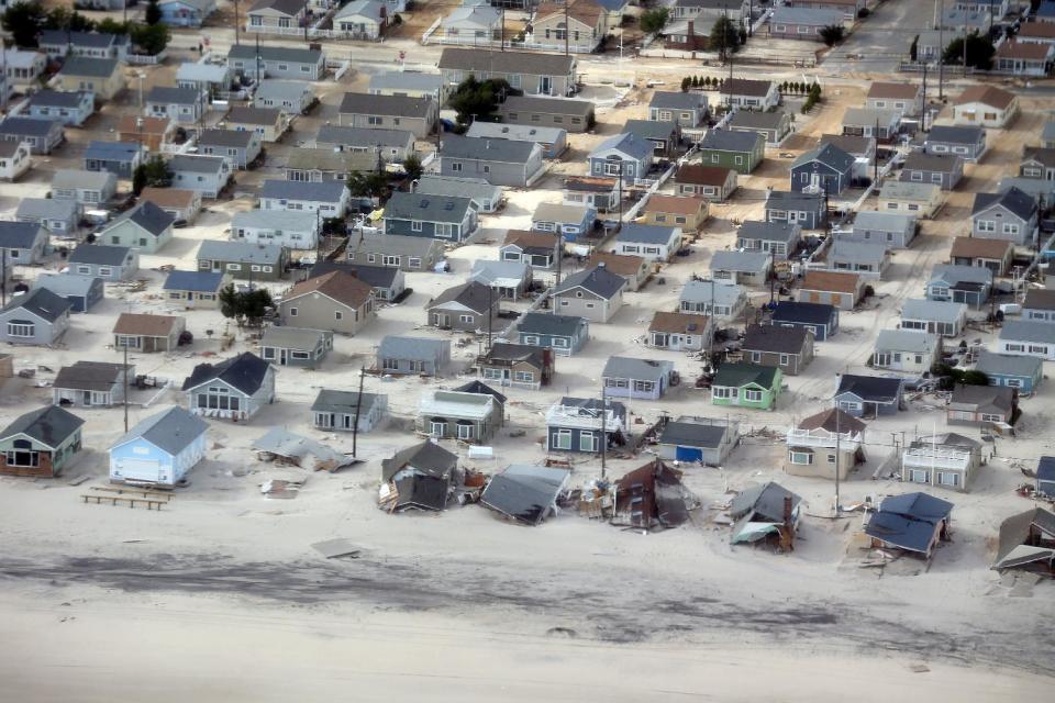 This aerial view of storm damage over the Atlantic Coast in Seaside Heights, N.J., Wednesday, Oct. 31, 2012, taken from a helicopter traveling behind the helicopter carrying President Obama and New Jersey Gov. Chris Christie, as they viewed storm damage from superstorm Sandy. (AP Photo/Doug Mills, Pool)