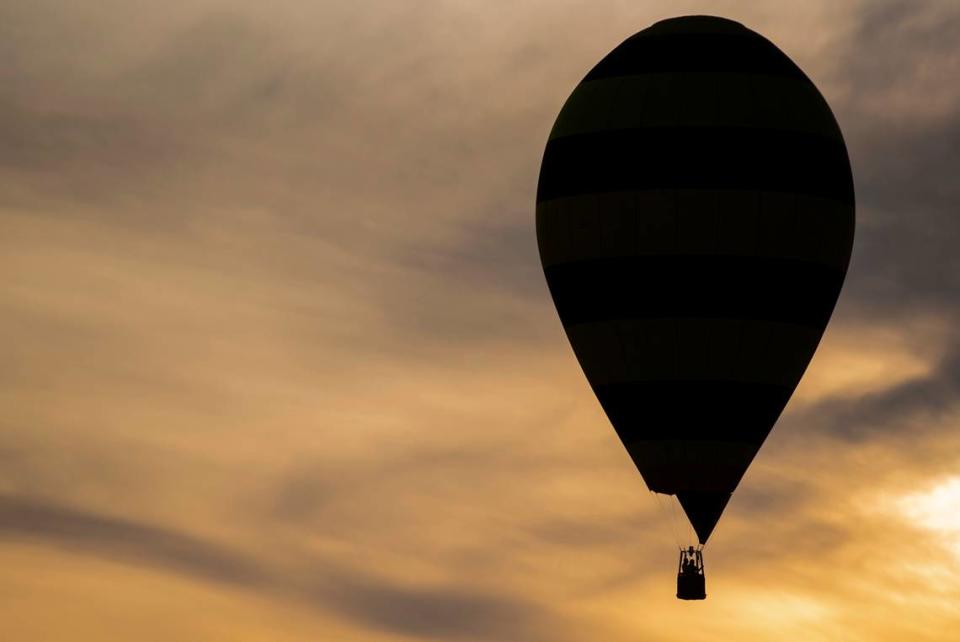 A hot air balloon called “Bee Bee King” flies over the Gulf Coast Hot Air Balloon Festival at OWA in Foley, Alabama on Thursday, May 4, 2023.