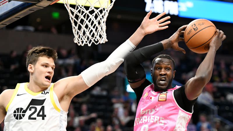 Utah Jazz center Walker Kessler (24) isn’t able to reach the ball as Breakers’ Mangok Mathiang turns as the Utah Jazz and the New Zealand Breakers play at the Delta Center in Salt Lake City on Monday, Oct. 16, 2023.