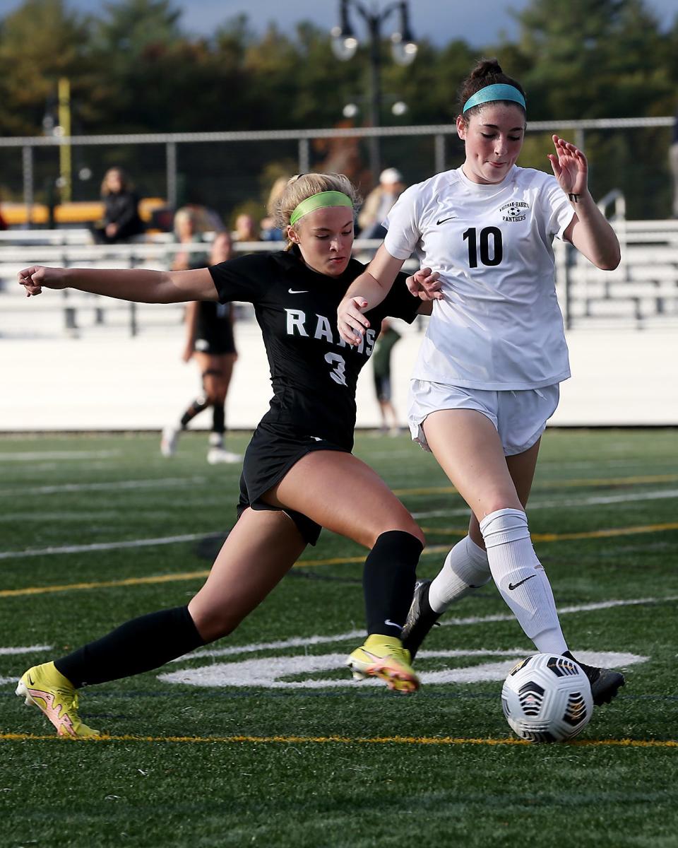 Whitman-Hanson's Makenna Marshall, right, looks to clear the ball away from Marshfield's Katerina Kiziuk during first half action of their game against Marshfield at Marshfield High on Tuesday, Oct. 18, 2022.