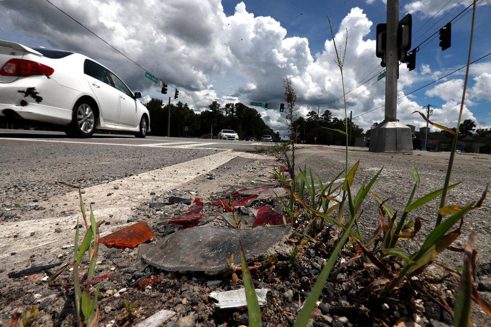 Fragments of broken head and tail lights litter the curb at the intersection of US 17 and Harris Trail Road in Richmond Hill.
