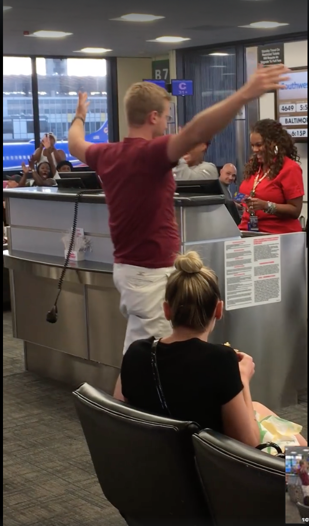 The man made his own entertainment while waiting to board the plane. Photo: Facebook