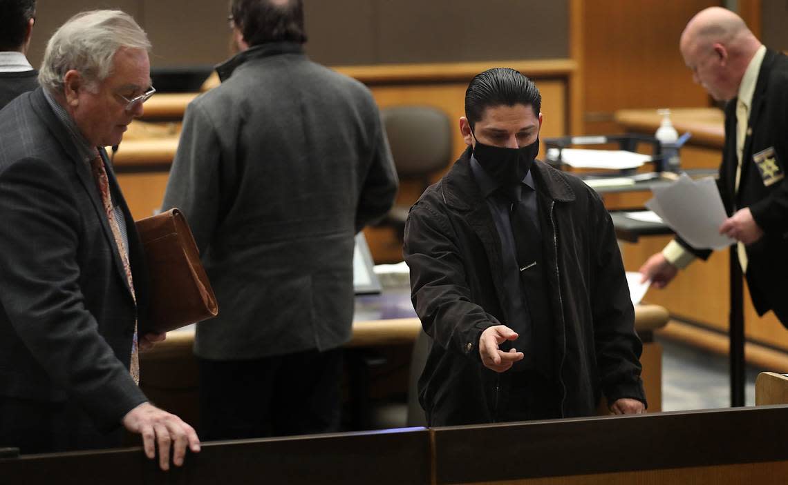 Rape suspect Elias Huizar, 39, of West Richland leaves a Feb. 15, 2024 hearing in Benton County Superior Court with his Yakima attorney Chris Tait, left, at the Benton County Justice Center in Kennewick. The former Yakima school resource officer faces charges for a sexual relationship with a teen girl and for raping her drunk friend.