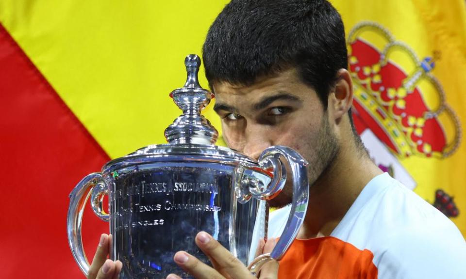 Carlos Alcaraz poses with the the US Open trophy last September