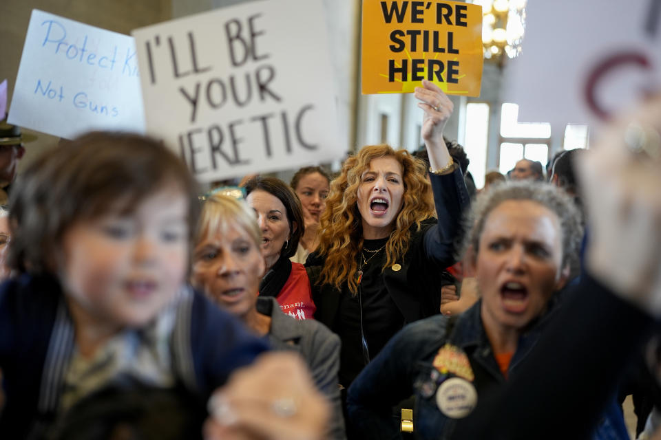 People protest outside the House chamber after legislation passed that would allow some teachers to be armed in schools during a legislative session Tuesday, April 23, 2024, in Nashville, Tenn. (AP Photo/George Walker IV)