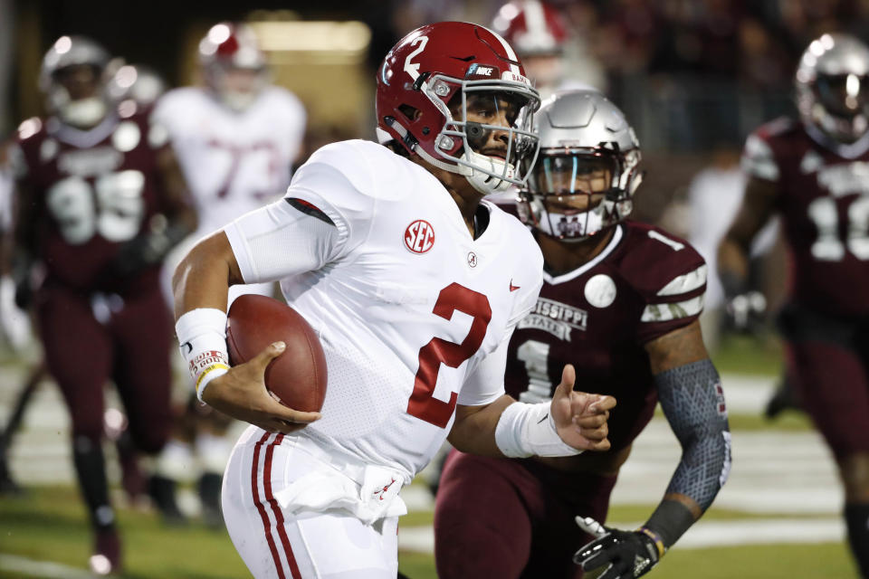 Alabama quarterback Jalen Hurts (2) sprints past Mississippi State defensive back Brandon Bryant (1) for a short touchdown run during the first half of an NCAA college football game in Starkville, Miss., Saturday, Nov. 11, 2017. (AP Photo/Rogelio V. Solis)