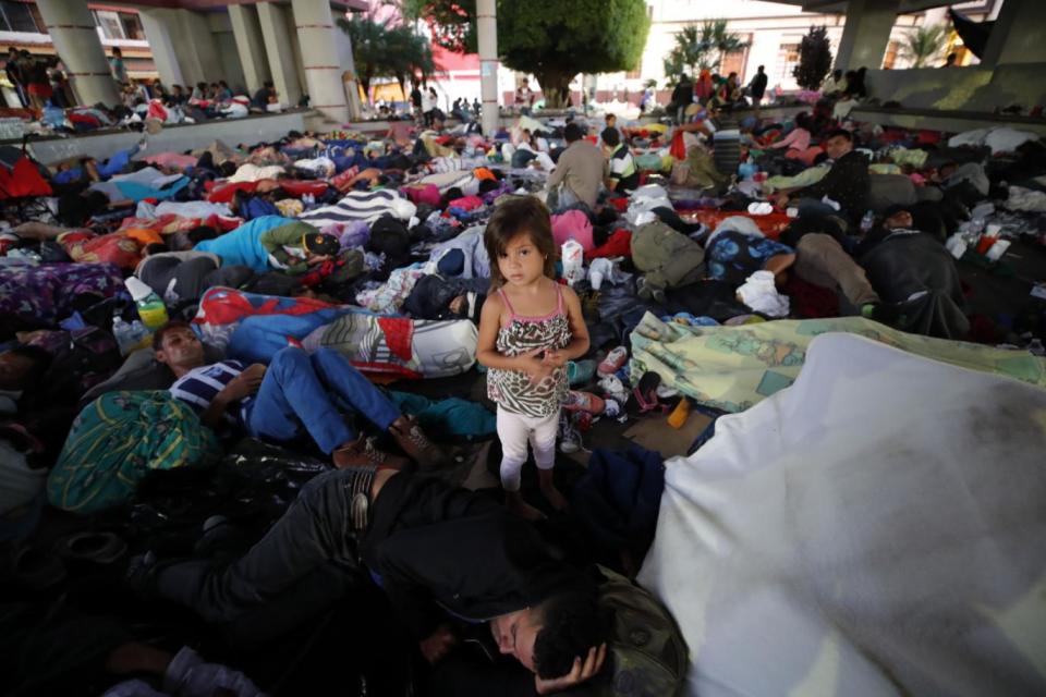 Honduran migrants rest in their camp in the Hidalgo garden of Tapachula (EPA)