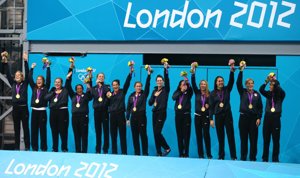 Gold medallists the United States celebrate on the podium during the medal ceremony for the Women's Water Polo on Day 13 of the London 2012 Olympic Games at the Water Polo Arena on August 9, 2012 in London, England. (Getty Images)