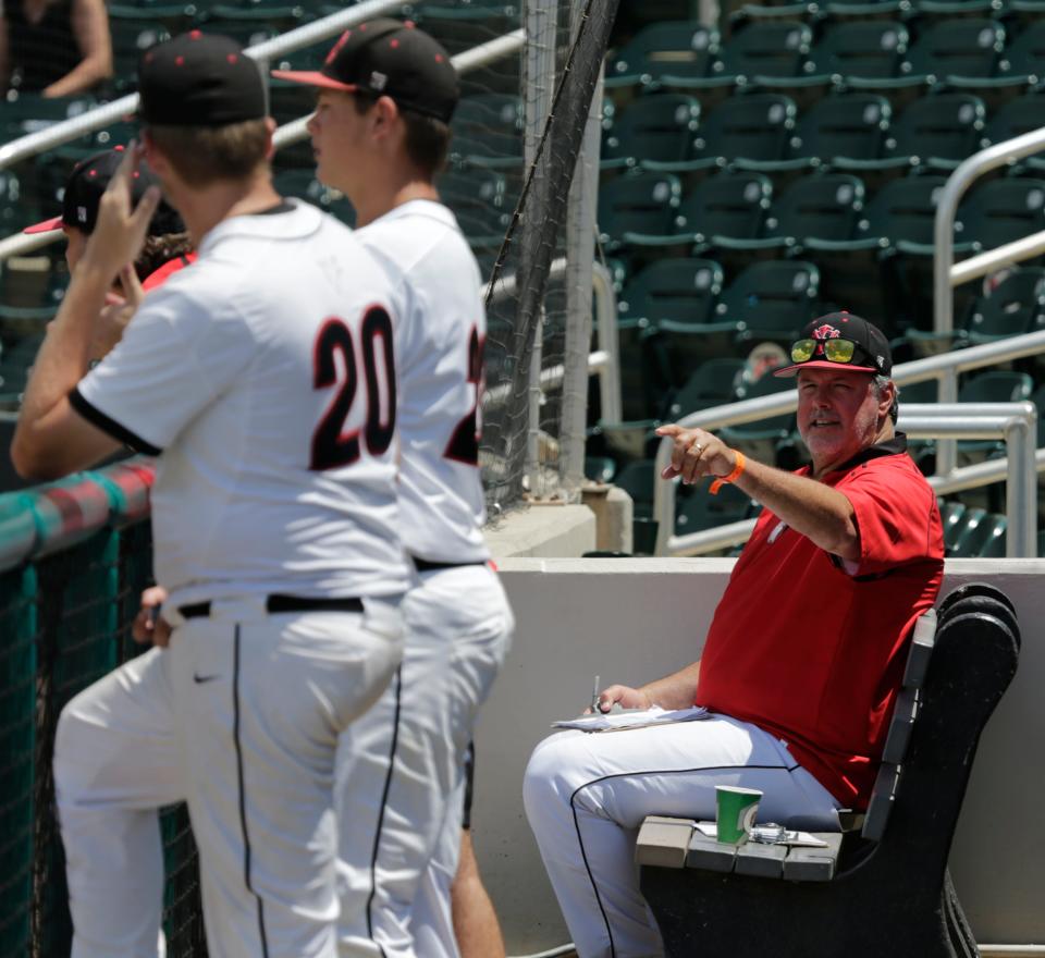 North Florida Christian coach Mike Posey makes a point against Out-of-Door Academy in the Class 2A baseball semifinal Monday, May 23 at Hammond Stadium at the Lee County Sports Complex in Fort Myers.