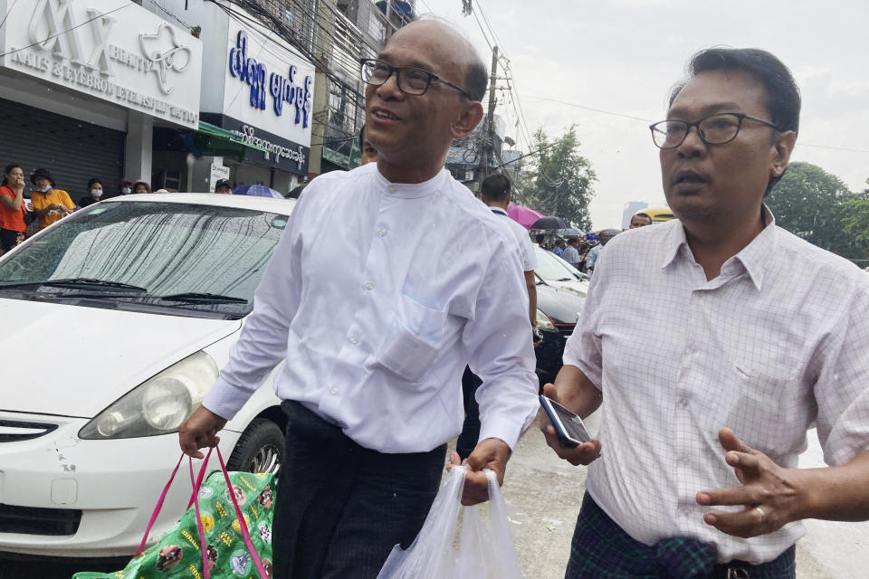 Mya Aye, left, a prominent leader from Myanmar's 88 Generation Students Group, walks together with his colleague as he release from Insein Prison Thursday, Nov. 17, 2022, in Yangon, Myanmar. The country's military-controlled government announced Thursday it was releasing and deporting an Australian academic, a Japanese filmmaker, an ex-British diplomat and an American as part of a broad prisoner amnesty to mark the country’s National Victory Day. (AP Photo)