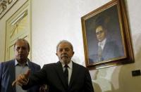 Brazil's former President Luiz Inacio Lula da Silva greets the media after a news conference with Rio de Janeiro's Governor Luiz Fernando Pezao (L) after a meeting in Rio de Janeiro, Brazil December 3, 2015. REUTERS/Ricardo Moraes/Files