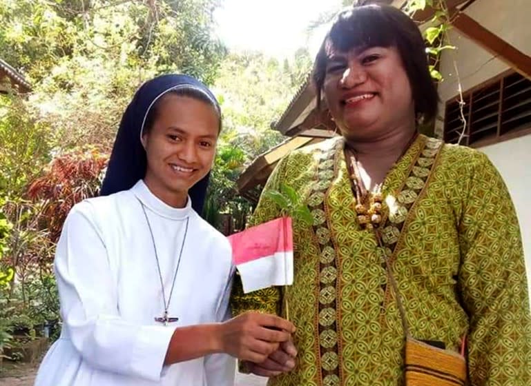 Hendrika Mayora Victoria Kelan (right), a former Catholic brother, remains active in her local parish.