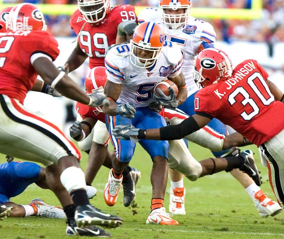 Florida's Andre Caldwell (5), running for yardage in the 2006 Florida-Georgia game, is third-all time for the Gators in career receiving.