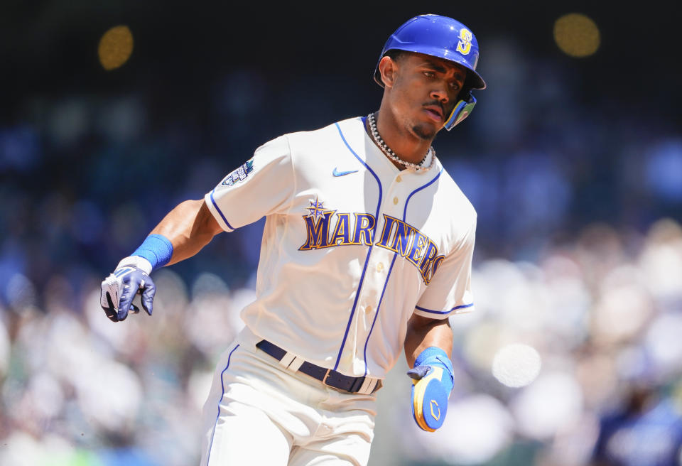 Seattle Mariners' Julio Rodriguez rounds third base to score on an RBI double by Ty France against the Tampa Bay Rays during the third inning of a baseball game, Sunday, July 2, 2023, in Seattle. (AP Photo/Lindsey Wasson)