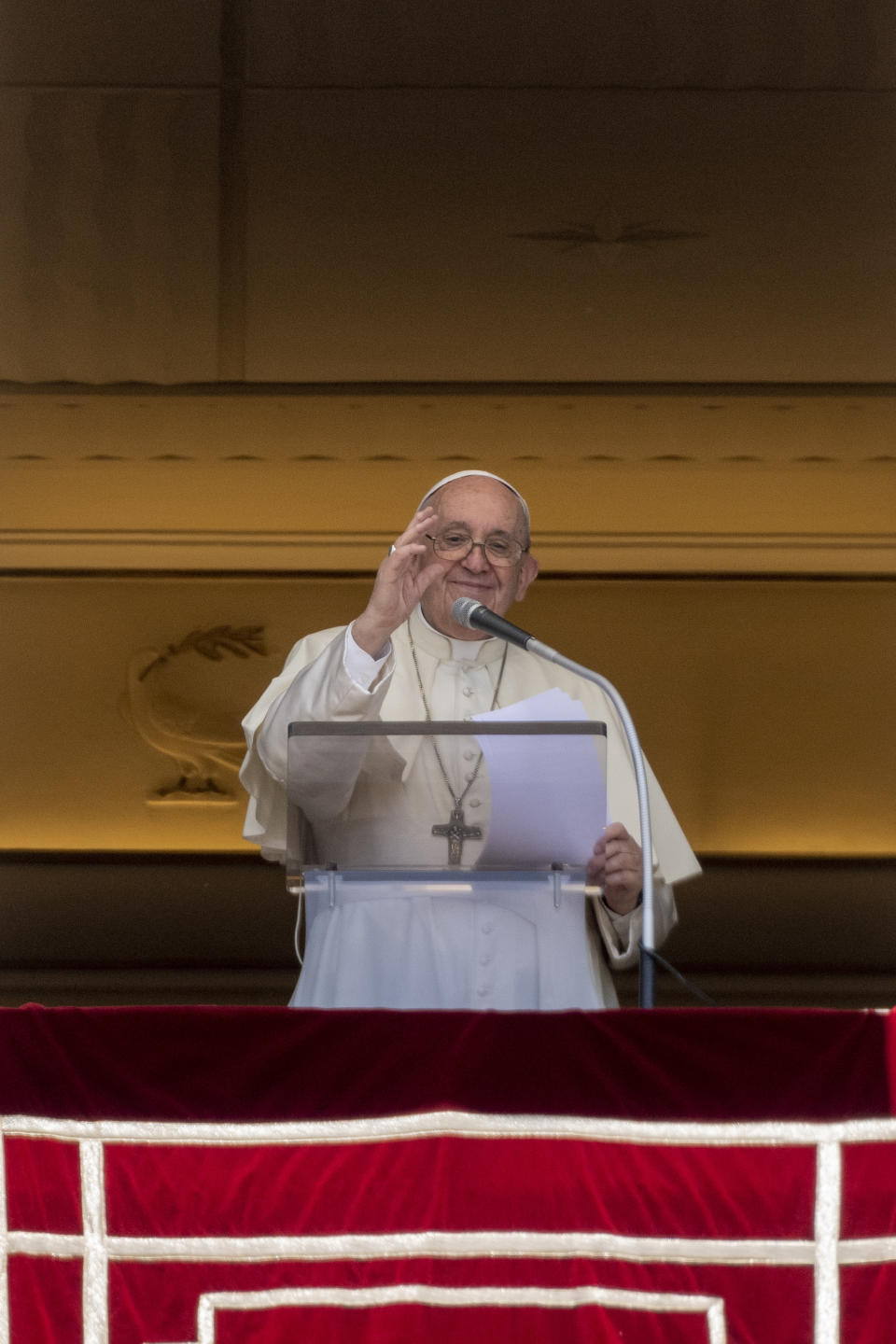 Pope Francis delivers his blessing as he recites the Regina Coeli noon prayer from the window of his studio overlooking St.Peter's Square, at the Vatican, Sunday, May 22, 2022. (AP Photo/Andrew Medichini)