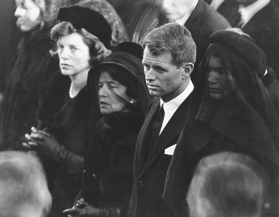 In this Nov. 25, 1963 file photo members of the Kennedy family attend U.S. President John F. Kennedy's burial at Arlington National Cemetery in Arlington, Va., including JFK's mother, Rose Kennedy, center left with veil; his brother U.S. Attorney General Robert F. Kennedy, center right; and the president's widowed wife, Jacqueline Kennedy, far right.