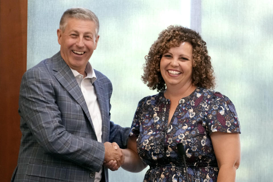 FILE - Bruce Hough and Celeste Maloy shake hands before the start of a 2nd Congressional District Republican primary debate for outgoing Rep. Chris Stewart's seat, Friday, Aug. 4, 2023, in Farmington, Utah. (AP Photo/Rick Bowmer, File)