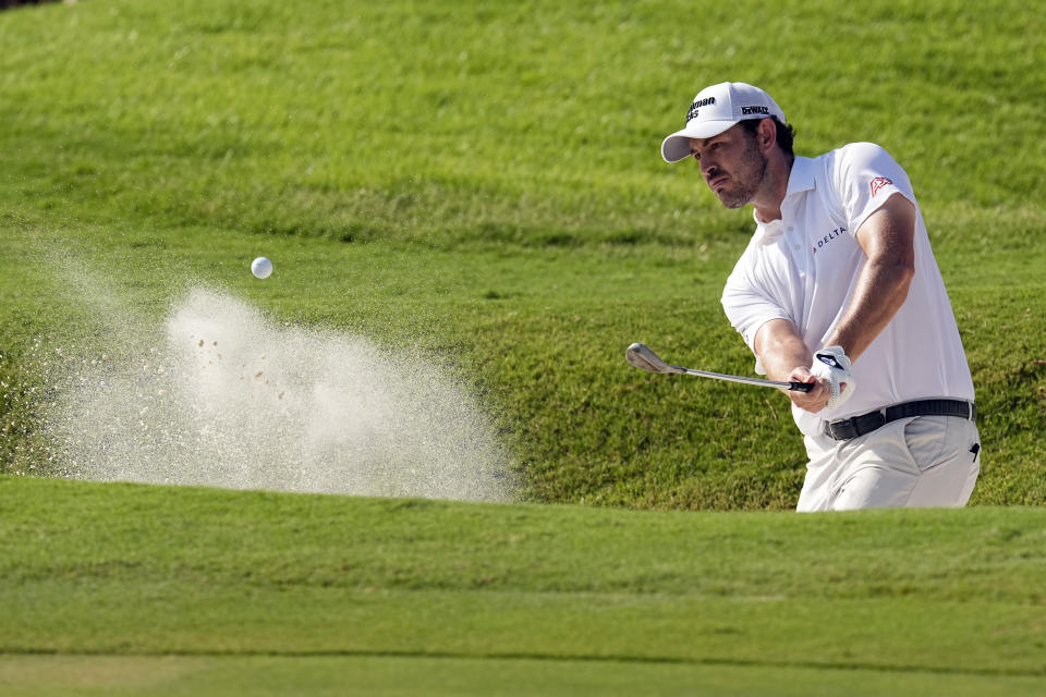Patrick Cantlay hits out of bunker to the13th green during the final round of the St. Jude Championship golf tournament Sunday, Aug. 13, 2023, in Memphis, Tenn. (AP Photo/George Walker IV)
