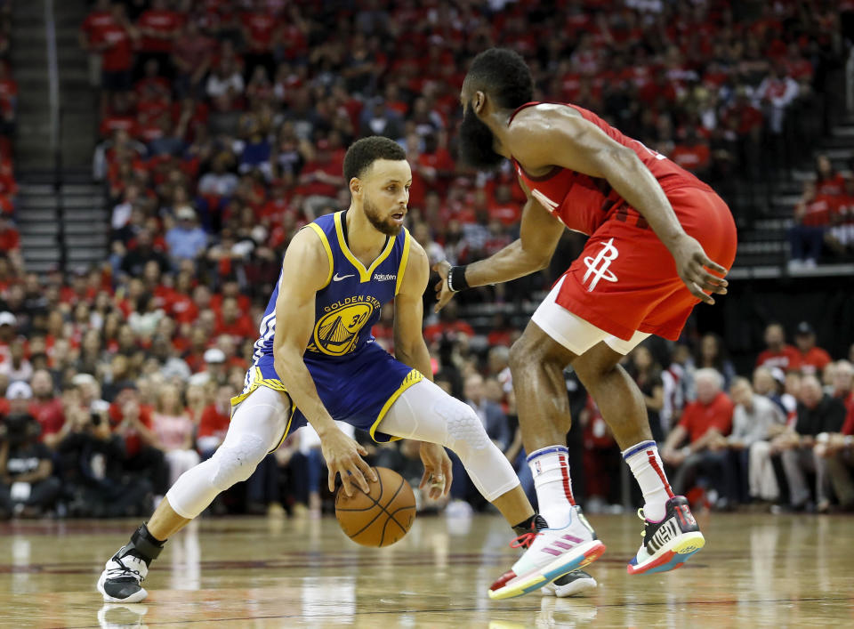 HOUSTON, TX - MAY 04:  Stephen Curry #30 of the Golden State Warriors dribbles the ball defended by James Harden #13 of the Houston Rockets in the fourth quarter during Game Three of the Second Round of the 2019 NBA Western Conference Playoffs at Toyota Center on May 4, 2019 in Houston, Texas.  NOTE TO USER: User expressly acknowledges and agrees that, by downloading and or using this photograph, User is consenting to the terms and conditions of the Getty Images License Agreement.  (Photo by Tim Warner/Getty Images)