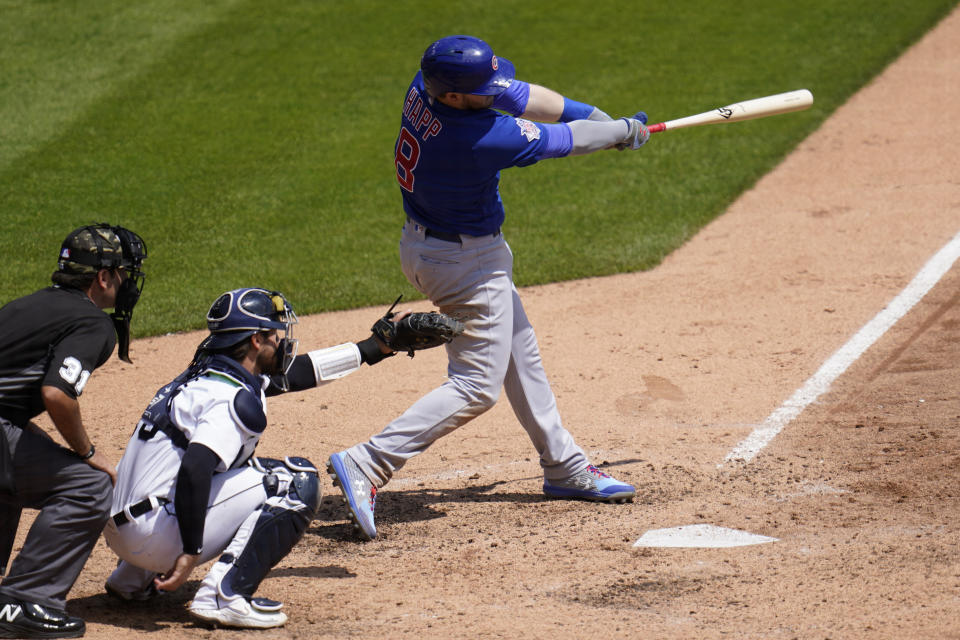 Chicago Cubs' Ian Happ hits a solo home run against the Detroit Tigers in the sixth inning of a baseball game in Detroit, Sunday, May 16, 2021. (AP Photo/Paul Sancya)