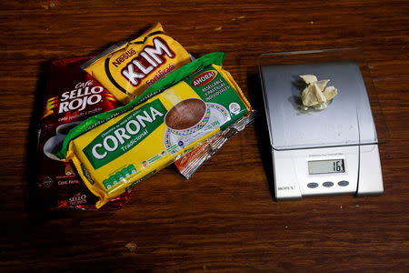 Grocery products lie next to coca paste worth $32,000 Colombian pesos at a local store in Guyabero Region, Guaviare, Colombia, May 24, 2016. REUTERS/John Vizcaino