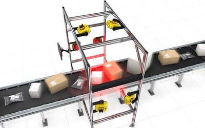  A Cognex Modular Vision Tunnel with 6 DataMan 380 vision systems mounted on a frame, installed over a conveyor belt moving a wide variety of packages.