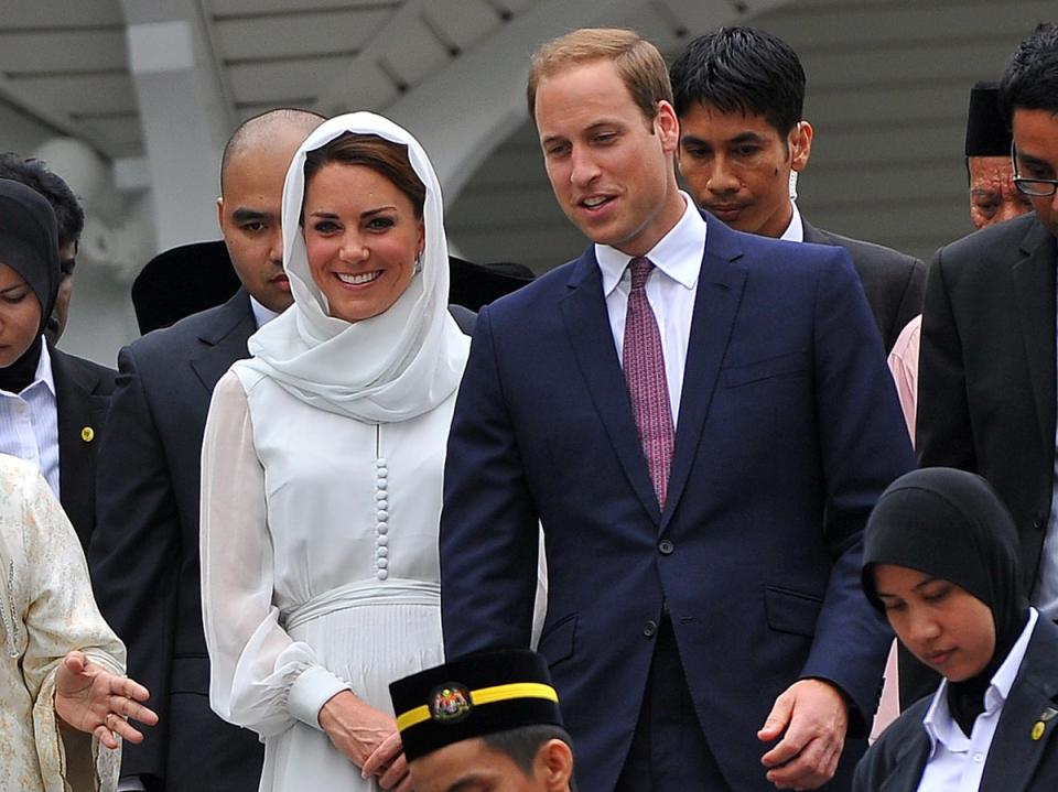 Prince William (centre R) and his wife Catherine, the Duchess of Cambridge (centre L) visit a mosque at KLCC in Kuala Lumpur on September 14, 2012 (AFP via Getty Images)