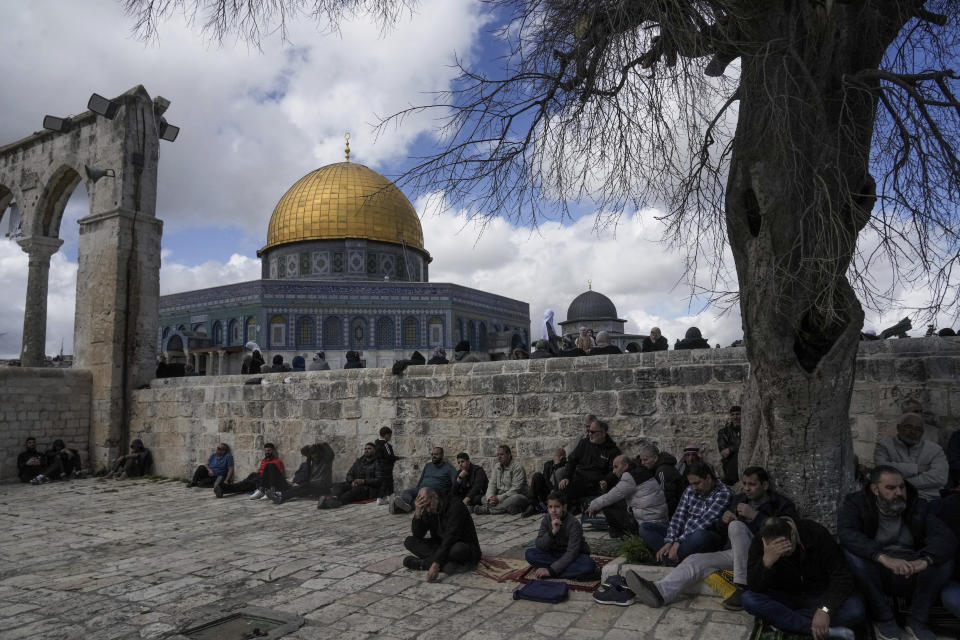 Muslim worshippers gather for Friday prayers by the Dome of Rock at the Al-Aqsa Mosque compound in the Old City of Jerusalem during the Muslim holy month of Ramadan on Friday, March 15, 2024. (AP Photo/Mahmoud Illean)